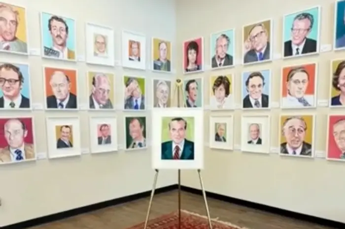 Nine painted portraits of figures associated with Nixon, including Nixon himself, on a wall.
